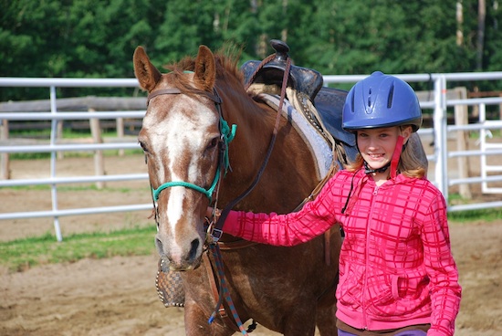 Girl leading horse